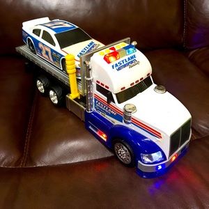 Toy tow-truck w/race car.
